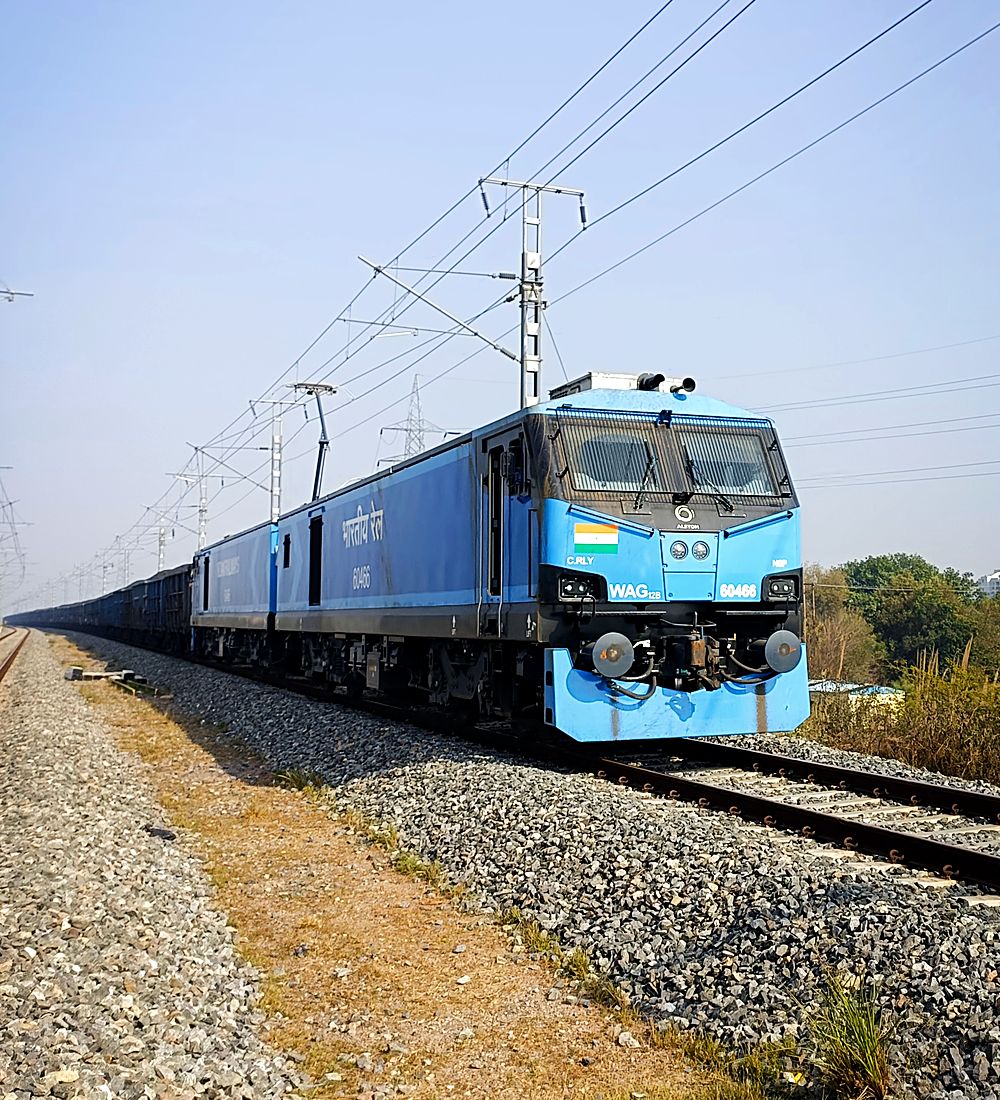 An Indian Railways electric locomotive at the head of a freight rake
